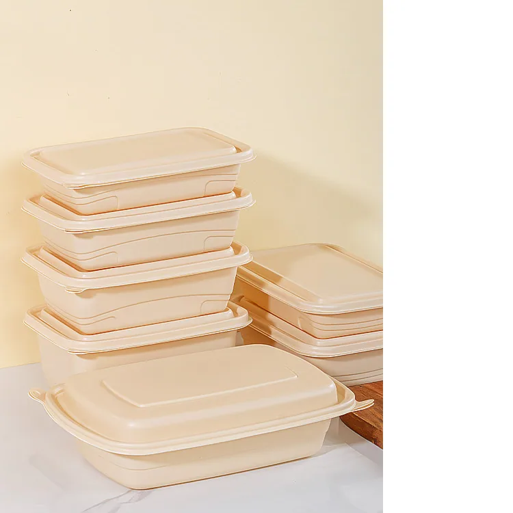 Stacked cornstarch-based takeaway food containers with matching lids