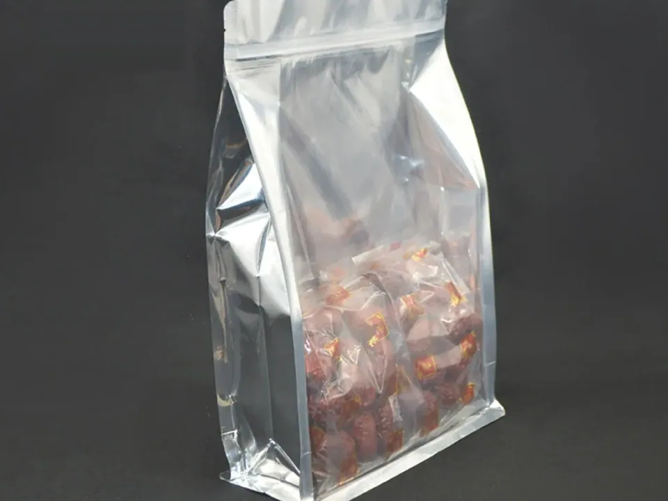 Clear and silver flat-bottom pouch filled with wrapped food