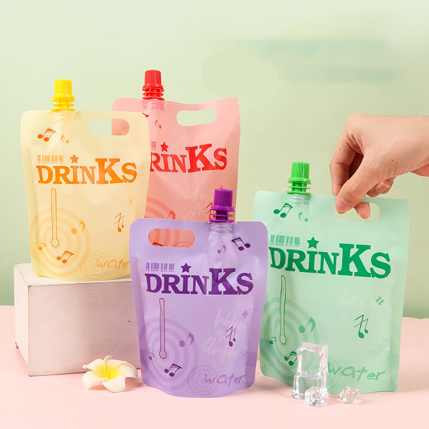 Four pastel custom-printed spout pouches with caps and carry handles